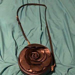 Black Michael Kors cross body bag with rose